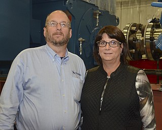 Katie Rickman | The Vindicator.Rick Dearing and his sister Becky Dearing pose for a photo in the shop of their family-run business Dearing Compressor and Pump Company in Youngstown on Friday Oct. 17, 2014.