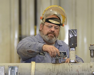 Katie Rickman | The Vindicator.Pat McClaskey works in the Dearing Compressor and Pump Company shop to assemble parts on Friday, Oct. 17, 2014.