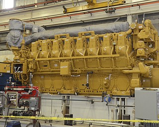 Katie Rickman | The Vindicator.A caterpillar engine sits in the shop at Dearing Compressor and Pump Company as workers assemble compressor/engine packages on Friday, Oct. 17, 2014.