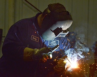 Katie Rickman | The Vindicator.Rodney Helsel welds piping for a compressor that is manufactured at Dearing Compressor and Pump Company in Youngstown on Friday, Oct. 17, 2014.