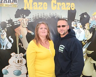 Katie Rickman | The Vindicator.Owners of Maze Craze in New Springfield Cindy and her husband Mike Bacon pose for a photo at the location of the maize on Friday, September 17, 2014.