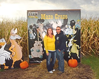 Katie Rickman | The Vindicator.Owners of Maze Craze in New Springfield Cindy and her husband Mike Bacon pose for a photo at the location of the maize on Friday, September 17, 2014.