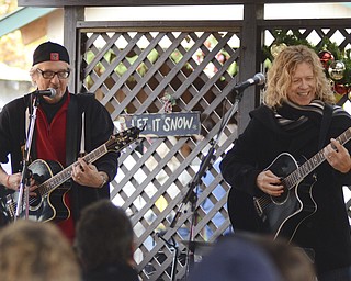 Katie Rickman | The Vindicator.B.E. Taylor, on right, performs alongside Rick Witkowski to a large crowd at Christmas in the Woods on Saturday, Oct. 18, 2014.