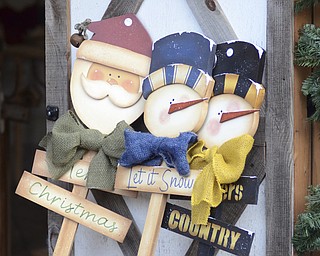 Katie Rickman | The Vindicator.Yard ornaments lean against a building at Christmas in the Woods where shoppers get a head start for the coming Christmas season on Saturday, Oct. 18, 2014.