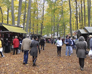 Katie Rickman | The Vindicator.The rainy, cold weather didn't keep shoppers away from Christmas in the Woods where they got a head start for the coming Christmas season on Saturday, Oct. 18, 2014.