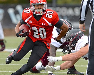 Jeff Lange | The Vindicator  Penguins' Jody Webb rushes past the tackle of a Salukis defender during first half action at Stambaugh Stadium, Saturday night.