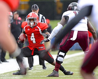 Jeff Lange | The Vindicator  Andre Stubbs of Youngstown runs out of bounds around SIU defender Victor Burnett in the second quarter of Saturday's matchup with the Salukis at Stambaugh Stadium.