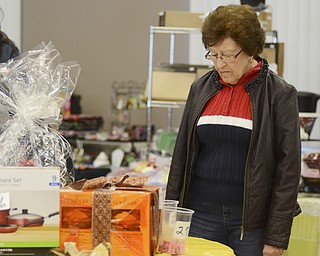 Katie Rickman | The Vindicator.Rose Morris of Campbell looks at raffle items during the Fall Festival hosted by Campbell Pride at Roosevelt Park in Campbell on Sunday, Oct. 19, 2014.
