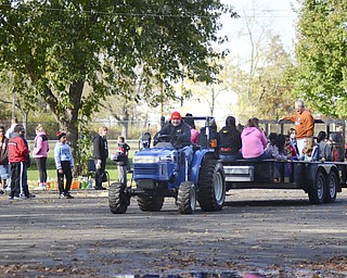 Katie Rickman | The Vindicator.Children and adults enjoy a hay ride during the Fall Festival hosted by Campbell Pride at Roosevelt Park in Campbell on Sunday, Oct. 19, 2014.