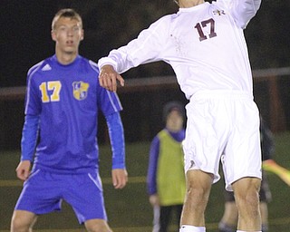 William D. Lewis The Vindicator SR's Matt Russ(17) headsthe ball past Lake Center's Drew Domer(17) during 10-21-14 action at SR.