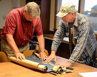 Katie Rickman | The Vindicator Bill Long, right, of Minerva shows abounded mine blue prints from his home to Jim Bishop, Abandoned Mine Lands Adminisitrator at ODNR, Long found the blueprints at his home.