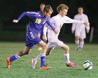 South Range’s Brooks Thomas (1) and Lake Center’s Riley Shultz (19) chase the ball during a Division III district semifinal Tuesday night. The Raiders won, 2-0, and will meet Ursuline in a district final on Saturday.
