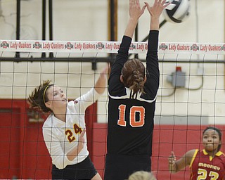 Katie Rickman | The Vindicator.Mineral Ridge's Peyton Allen (10) attempts to block a shot by Mooney's Mckenzie Reese during the district semifinal game at Salem High School on Wednesday, Oct. 22, 2014.