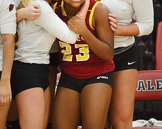 Mooney’s Makenna Ozenghar, left, embraces Lauren Lottier after the Cardinals downed the Mineral Ridge Rams, 3-1, in a Division III volleyball district final Wednesday at Salem High School. Ozenghar not only stepped in for injured teammate Gina Patella, but she also provided the turning point for the Cardinals.