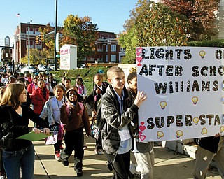 Hundreds of Youngstown City Schools students marched along Wood Street in Youngstown on Thursday in a parade that was part of Lights On Afterschool, an event hosted by the Youngstown Afterschool Alliance to
promote the after-school programs attended by about 300 Youngstown students.
