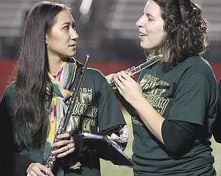 William D. Lewis the Vindicator  URsuline  alums perform 10242014 during pregame. Chelsea Henrie(06), left, and Janet Sauline (06) share a moment .
