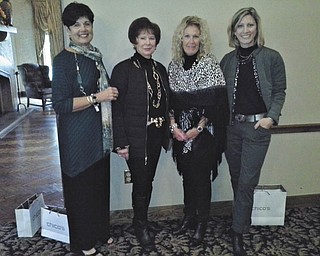 SPECIAL TO THE VINDICATOR
Youngstown Area Federation of Women’s Clubs, Inc., hosted an Autumn Splendor luncheon on Oct. 15 at the Tippecanoe Country Club in Canfield. Deanna Altnar, manager, and Rana Pochiro, assistant manager, both of Chico’s, presented the fall fashion show. Models were Beverly Muresan, left, Geri Kosar, Marilyn Weaver and Tamara Sigler. The next meeting will be a joint meeting with Fortnightly IV at 6 p.m. Nov. 19 at A La Cart, 429 Lisbon St. in Canfield. The speaker will be Casey Malone, and the meditation will be given by Lucile Bartelmay. Guests are welcome.