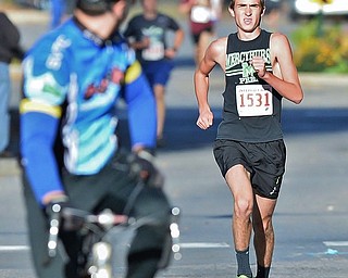 Jeff Lange | The Vindicator  Junior from Austintown Fitch High School, Matt Rozic (1531) races ahead of the competition as he nears the finish line of the 2 mile race, Sunday morning in Youngstown.