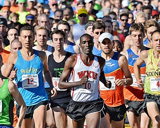 Jeff Lange | The Vindicator  Patrick Cheptoek (10) of Bowling Green leads the pack from the starting line during the Peace Race 10K competition held in Youngstown, Sunday morning. Cheptoek went on to capture first place.