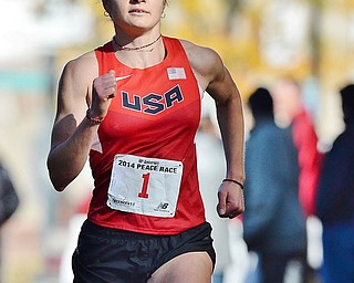 Jeff Lange | The Vindicator 2012 Olympian and resident of Hiram, Bridget Franek races to the finish of Sunday's 39th annual Peace Race in Youngstown.