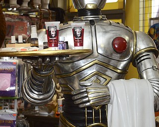 Katie Rickman | The Vindicator.A statue of C-3PO  at Quincy's Costumes in Youngstown holds a tray with fake blood and Spirit Gum Remover on Tuesday, Oct. 21, 2014.