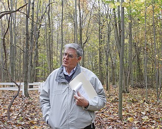        ROBERT K. YOSAY  | THE VINDICATOR..Standing on one of the new paths with the fern area behind him.Mike Heher, chairman of the park board, at the Poland Twp Park talks about the 20+ new species of trees that have been added to the park since it opened in 2009.as wellas trails, fern area and butterfly area.  ..-30-