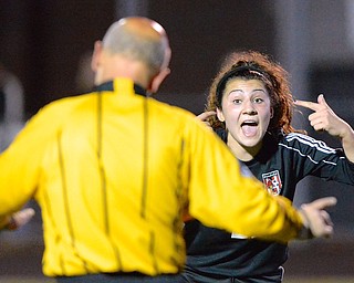 Jeff Lange | The Vindicator  Canfield sophomore Anita Mancini disputes a call made by officials regarding a missed Canfield goal in the first half of the Cardinal's matchup with Lake Catholic, Tuesday evening.