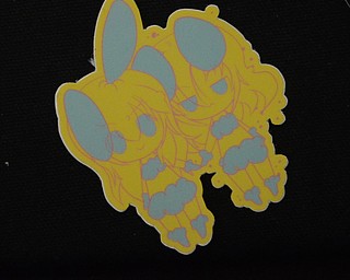 Katie Rickman | The Vindicator .Stickers, books, buttons, and patches are among the many items made by Black Street Entertainment owners Justin and Terry Raimey of Youngstown.  Shown here is a patch made by the company.