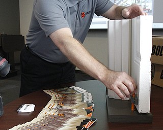        ROBERT K. YOSAY  | THE VINDICATOR..William Barna - shows off BOLO STICK at a YSU press conference- its for locking classroom doors ..-30-