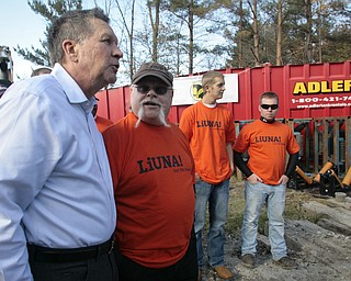        ROBERT K. YOSAY  | THE VINDICATOR..Bob Chatterson of LOCAL 125  tells the governor how the pipe installation is taking place as his crew is working on the pipeline..The Ohio LaborersÕ District Council endorsed Gov. John Kasich and Lt. Gov. Mary Taylor in Boardman Thursday afternoon. The endorsement took place at a transmission line site on Market Street with members of the Ohio Laborers Local 125 in attendance.-30-