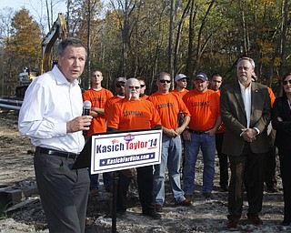        ROBERT K. YOSAY  | THE VINDICATOR..Gov Kasich talks about hiring OHIO workers for construction jobs as Ken Holland - Secretary and Mary Taylor look on ..The Ohio LaborersÕ District Council endorsed Gov. John Kasich and Lt. Gov. Mary Taylor in Boardman Thursday afternoon. The endorsement took place at a transmission line site on Market Street with members of the Ohio Laborers Local 125 in attendance.-30-