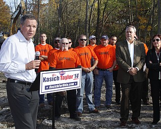        ROBERT K. YOSAY  | THE VINDICATOR..Gov Kasich talks about hiring OHIO workers for construction jobs as Ken Holland - Secretary and Mary Taylor look on ..The Ohio LaborersÕ District Council endorsed Gov. John Kasich and Lt. Gov. Mary Taylor in Boardman Thursday afternoon. The endorsement took place at a transmission line site on Market Street with members of the Ohio Laborers Local 125 in attendance.-30-