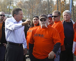        ROBERT K. YOSAY  | THE VINDICATOR..Bob Chatterson of LOCAL 125  tells the governor how the pipe installation is taking place as his crew is working on the pipeline..The Ohio LaborersÕ District Council endorsed Gov. John Kasich and Lt. Gov. Mary Taylor in Boardman Thursday afternoon. The endorsement took place at a transmission line site on Market Street with members of the Ohio Laborers Local 125 in attendance.-30-