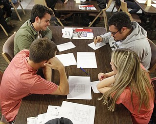        ROBERT K. YOSAY  | THE VINDICATOR..Group effort- clockwise from far left bottom  is Nicholas Downing - James a Garfield--Scott Donnachie -Poland-- Jordan Small - Windham -- and Samantha Renzenbrink - Liberty.. More than 400 students from 39 high schools from throughout Northeast Ohio filled Youngstown State UniversityÕs Kilcawley Center Chestnut Room Thursday for MathFest hosted by YSUÕs mathematics and statistics department...-30-