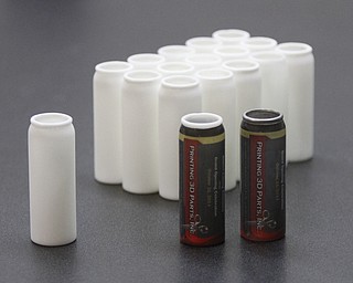        ROBERT K. YOSAY  | THE VINDICATOR..plastic bottles complete with labels done at the facility..Printing 3-D Parts is a commercial enterprise that uses 3-D printing and scanning technologies in production for the packaging and container industries. The company claims to be the first of its kind in the Mahoning Valley....-30-