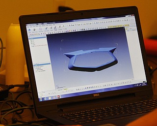        ROBERT K. YOSAY  | THE VINDICATOR..a 52 chevy part is scanned into the printer Printing 3-D Parts is a commercial enterprise that uses 3-D printing and scanning technologies in production for the packaging and container industries. The company claims to be the first of its kind in the Mahoning Valley....-30-