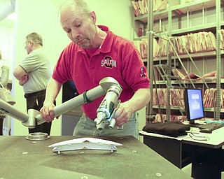        ROBERT K. YOSAY  | THE VINDICATOR..Scanning in a part into the printer is Bill Hallewell... .of salem.. Printing 3-D Parts is a commercial enterprise that uses 3-D printing and scanning technologies in production for the packaging and container industries. The company claims to be the first of its kind in the Mahoning Valley....-30-