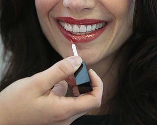        ROBERT K. YOSAY  | THE VINDICATOR...Lucia carns touches up Cristina Memo ..A locally-owned beauty shop in Boardman recently opened a new location and offers a variety of services from airbrush makeup to extensions and tanning. , has expanded her client base through social media and her work. She does her work with an all-natural makeup she sells at her shop..-30-