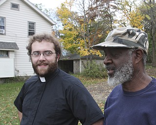 William D. Lewis the vindicator .Rev Dave Kamphuis, pastor Msrtin Luther Lutheran Church , Youngstown, left, and Charles Hudson who runs a youth program at the church.