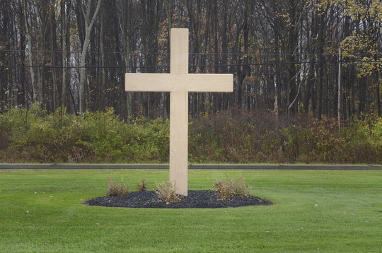 Katie Rickman | The Vindicator.A cross at the entry of All Souls Cemetery in Cortland, Ohio on Tuesday, Oct. 28, 2014.