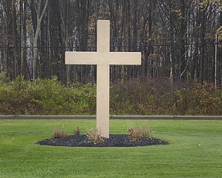 Katie Rickman | The Vindicator.A cross at the entry of All Souls Cemetery in Cortland, Ohio on Tuesday, Oct. 28, 2014.