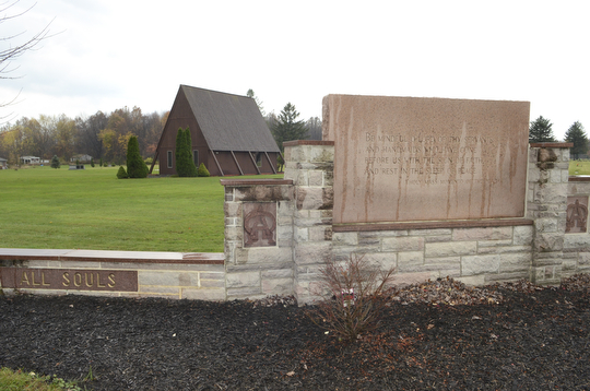 Katie Rickman | The Vindicator.The mausoleum stands behind one of the entry signs at  All Souls Cemetery in Cortland, Ohio on Tuesday, Oct. 28, 2014.
