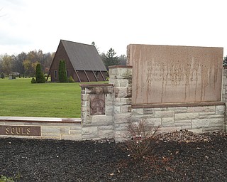 Katie Rickman | The Vindicator.The mausoleum stands behind one of the entry signs at  All Souls Cemetery in Cortland, Ohio on Tuesday, Oct. 28, 2014.