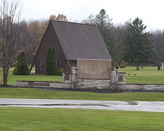 Katie Rickman | The Vindicator.The mausoleum stands behind one of the entry signs at  All Souls Cemetery in Cortland, Ohio on Tuesday, Oct. 28, 2014.