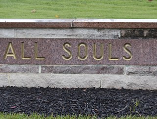 Katie Rickman | The Vindicator.A sign on the brick wall entry way at All Souls Cemetery in Cortland, Ohio on Tuesday, Oct. 28, 2014.