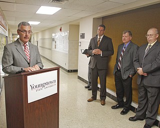        ROBERT K. YOSAY  | THE VINDICATOR..President Jim Tressel - Rep Tim Ryan - Tim Wagner (YSU) and Allen Hunter (YSU)  National Science Foundation-supported chemistry lab that places Youngstown State University among the best in the nation for materials analysis with a new x-ray diffraction Labratory . .-30-