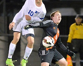 Jeff Lange | The Vindicator  Poland's Anthony Sabula (10) and Marlington's Dillon Wright (6) both fight for the ball during the first half of their regional semi-final match in Wadsworth, Wednesday night.