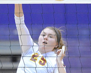 Jeff Lange | The Vindicator  Mooney's Nichole Webber (25) spikes the ball over the net during the Cardinal's matchup Thursday evening with the Gilmour Academy Lancers in Barberton.