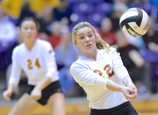 Jeff Lange | The Vindicator  Makenna Ozenghar (22) of Mooney bumps the ball out of bounds during game three of Cardinal's loss to Gilmour Academy, Thursday night in Barberton.