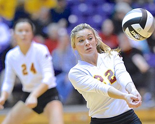 Jeff Lange | The Vindicator  Makenna Ozenghar (22) of Mooney bumps the ball out of bounds during game three of Cardinal's loss to Gilmour Academy, Thursday night in Barberton.